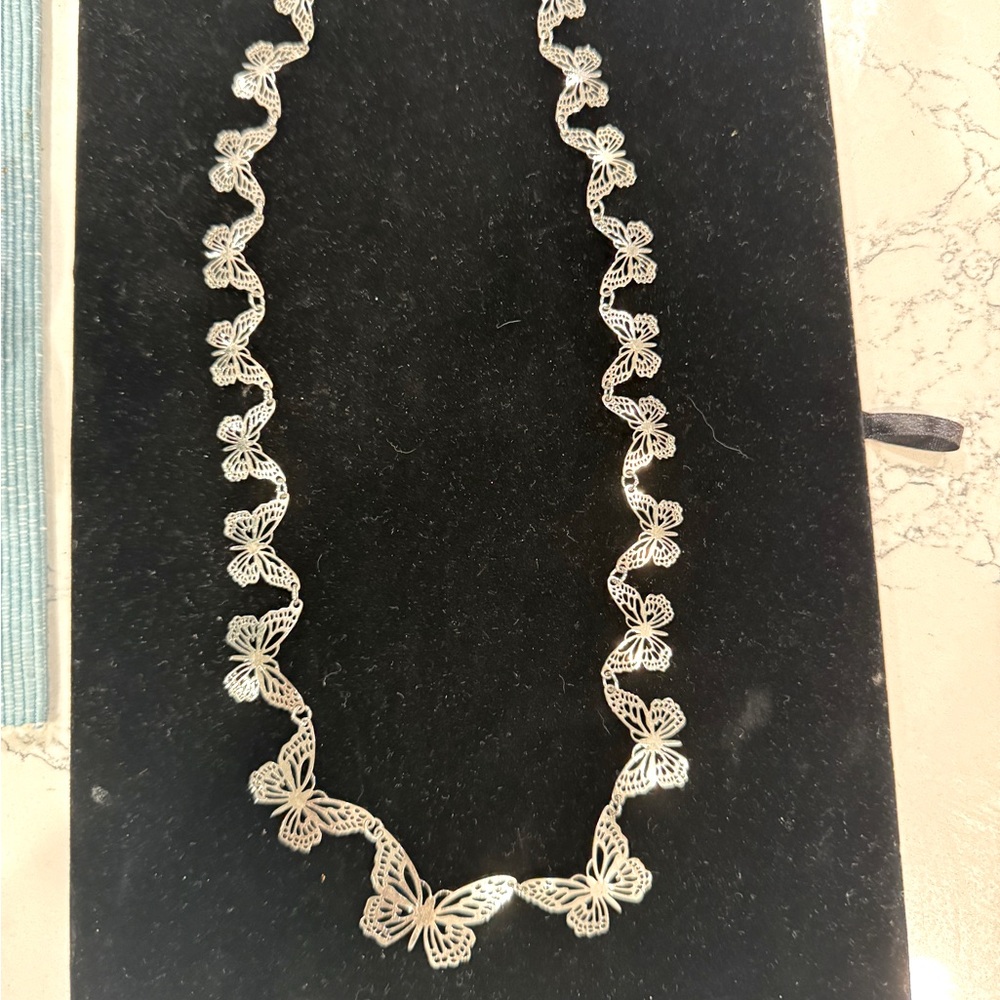 Vintage 11” silver tone butterfly necklace. GUC